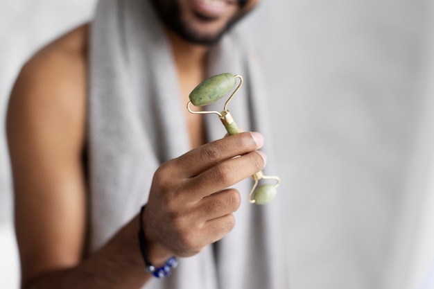 Free photo young male doing selfcare routine