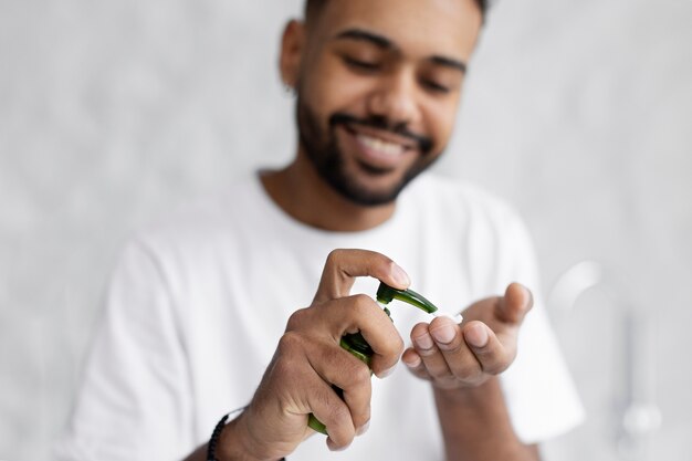 Young male doing selfcare routine