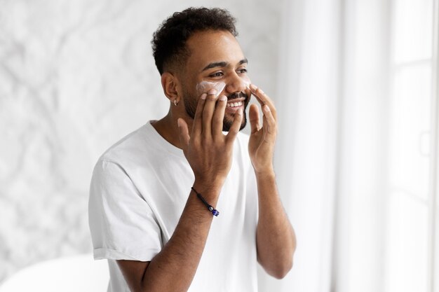 Young male doing selfcare routine