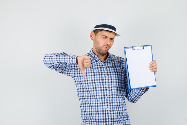 Young male holding clipboard