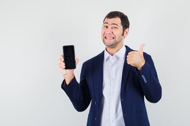 Young male holding mobile phone