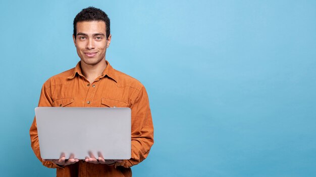 Young male holding a notebook