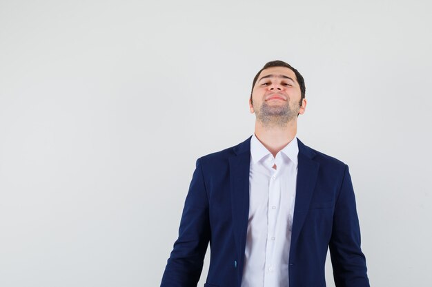 Young male looking at camera in shirt