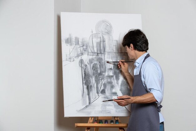 young male painter drawing beautiful painting white background art