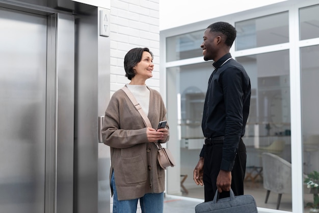 Free photo young male priest with a female worshiper meeting for direction