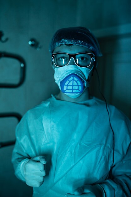 Young male researcher carrying out scientific experiment.