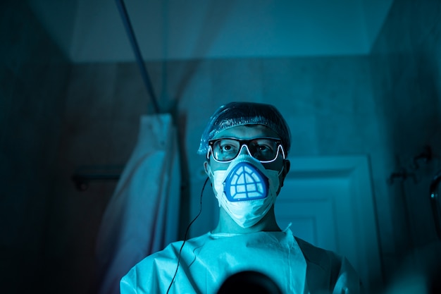 Young male researcher carrying out scientific experiment.