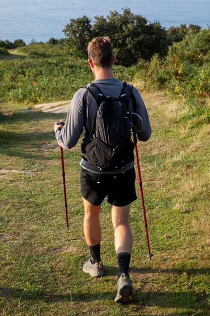 Young male traveler going to hike