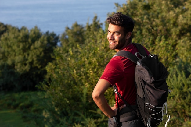Young male traveler going to hike
