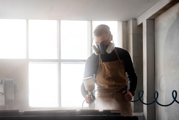 Young male working in a wood engraving workshop