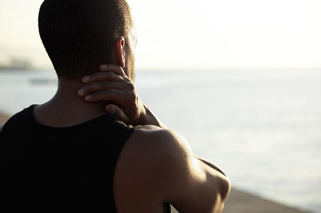 Young man admiring landscape at beach