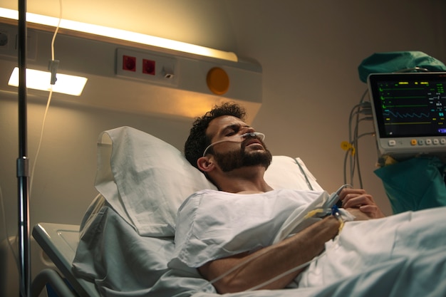 Young man being ill in a hospital bed