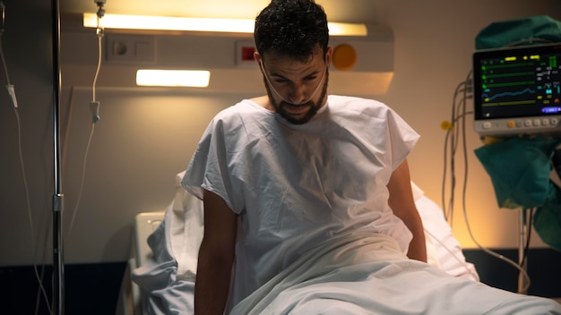 Young man being ill in a hospital bed