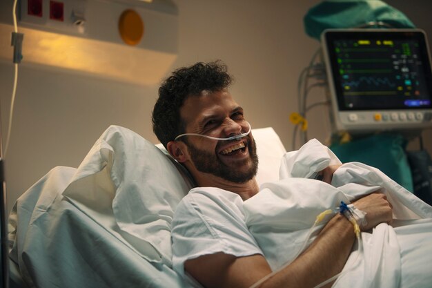 Young man being ill in a hospital bed