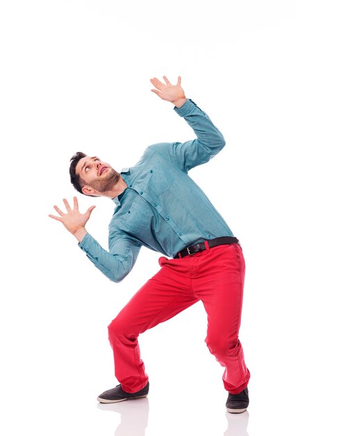 Young man bending under the weight of something