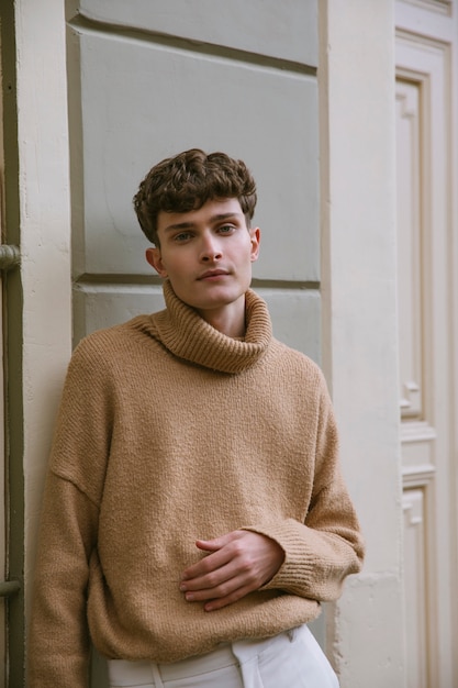 Young man in casual outfit posing