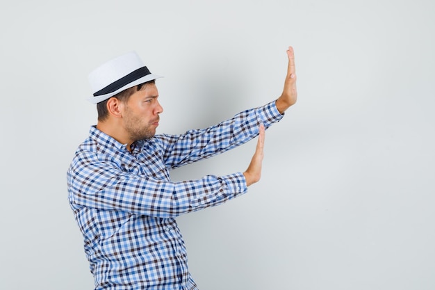 Young man in checked shirt