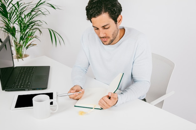 Young man checking his diary