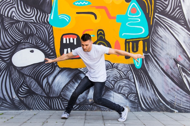 Young man dancing on street