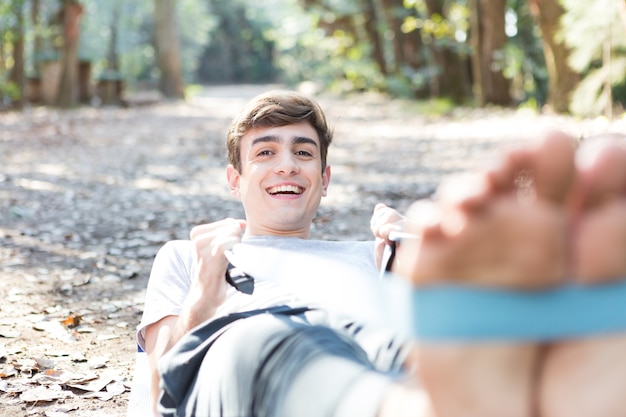 Free photo young man doing stretches with an elastic band