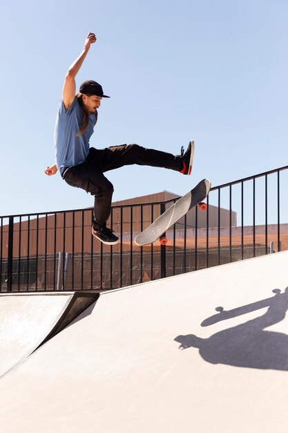 Young man doing trick on skate