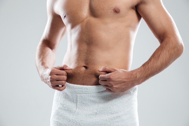 Young man dressed in towel