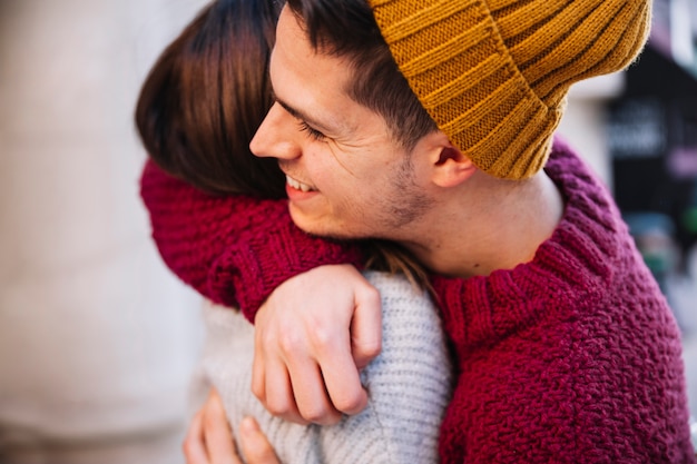 Free photo young man embracing woman