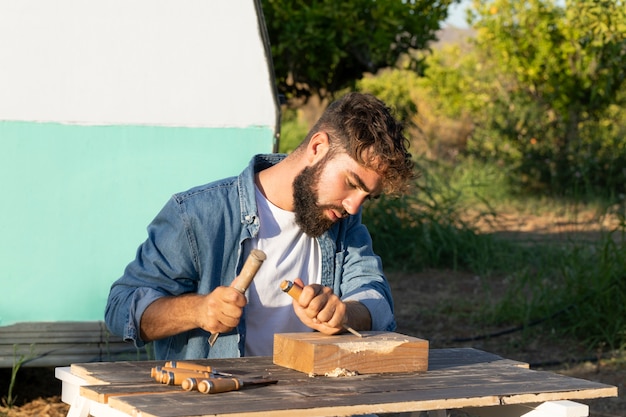 Young man engraving in wood