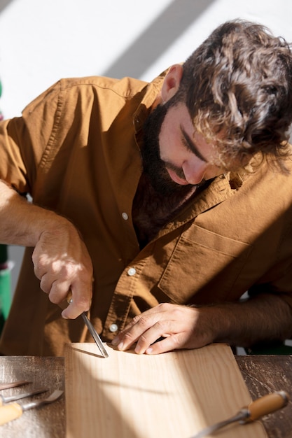 Young man engraving in wood