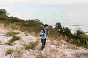 Free photo young man enjoying trip