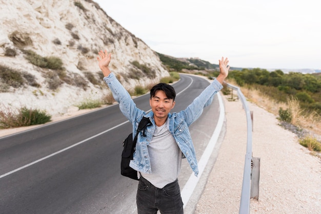 Free photo young man enjoying trip