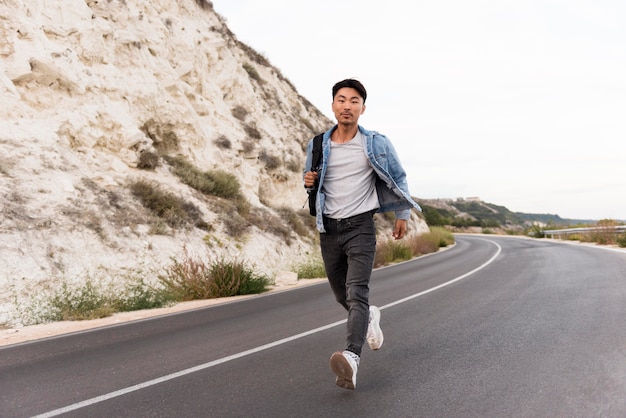 Free photo young man enjoying trip