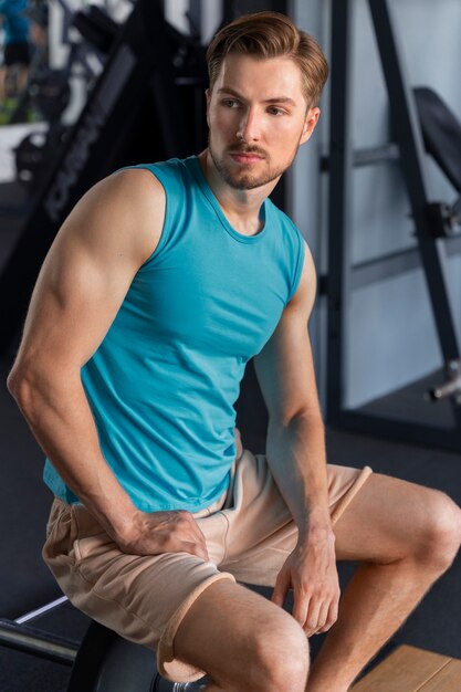 Young man exercising at the gym for bodybuilding