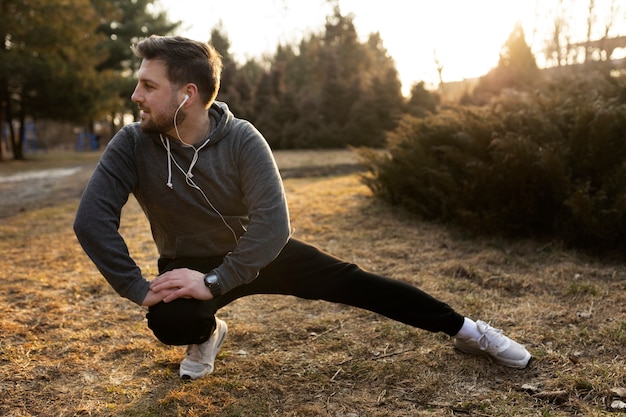 Free photo young man exercising outdoors in the park