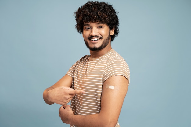 Free photo young man getting vaccinated