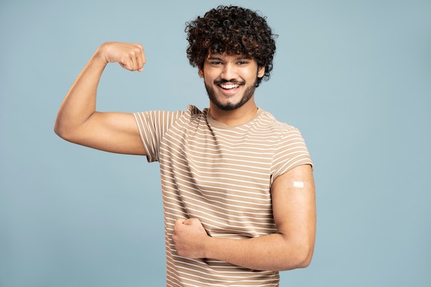 Free photo young man getting vaccinated