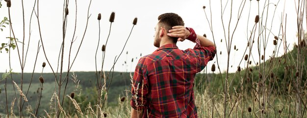 Young man in green field