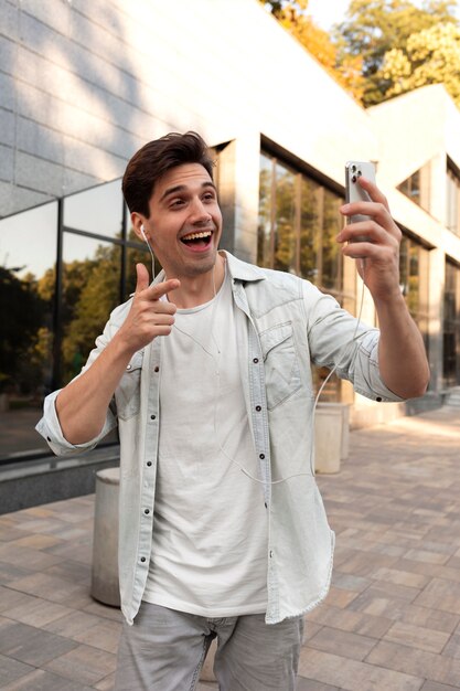 Young man having a video call on his smartphone