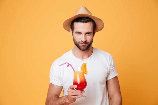 Young man holding cocktail