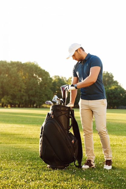 Young man holding golf club