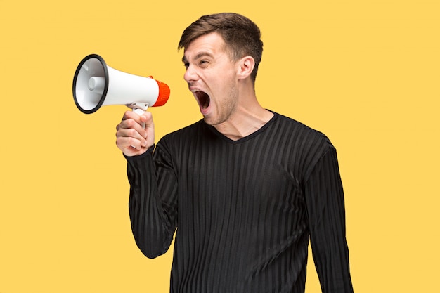 The young man holding a megaphone