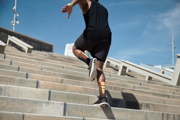 Young man jumping on stairs