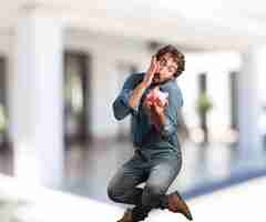 Free photo young man jumping. worried expression