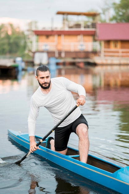 Young man kayaking concept