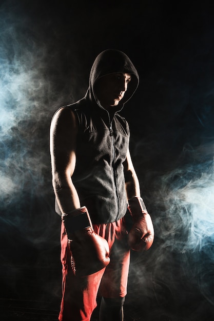 The young man kickboxing