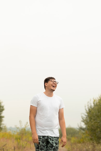 Free photo young man laughing and looking away