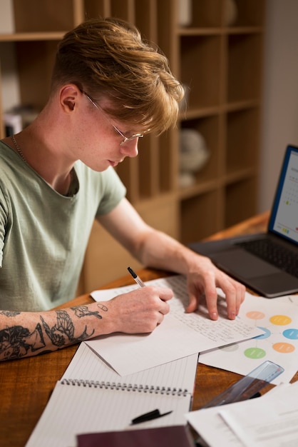 Young man learning in a virtual classroom