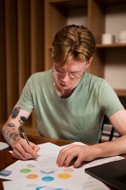 Young man learning in a virtual classroom