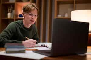 Free photo young man learning in a virtual classroom