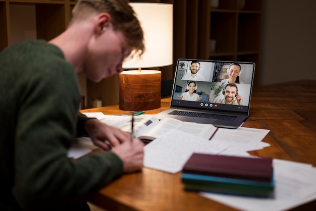 Young man learning in a virtual classroom